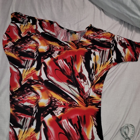 Ladies Artizan asymmetrical silky top. Can be worn super sexy off the shoulder. - Picture 2 of 4